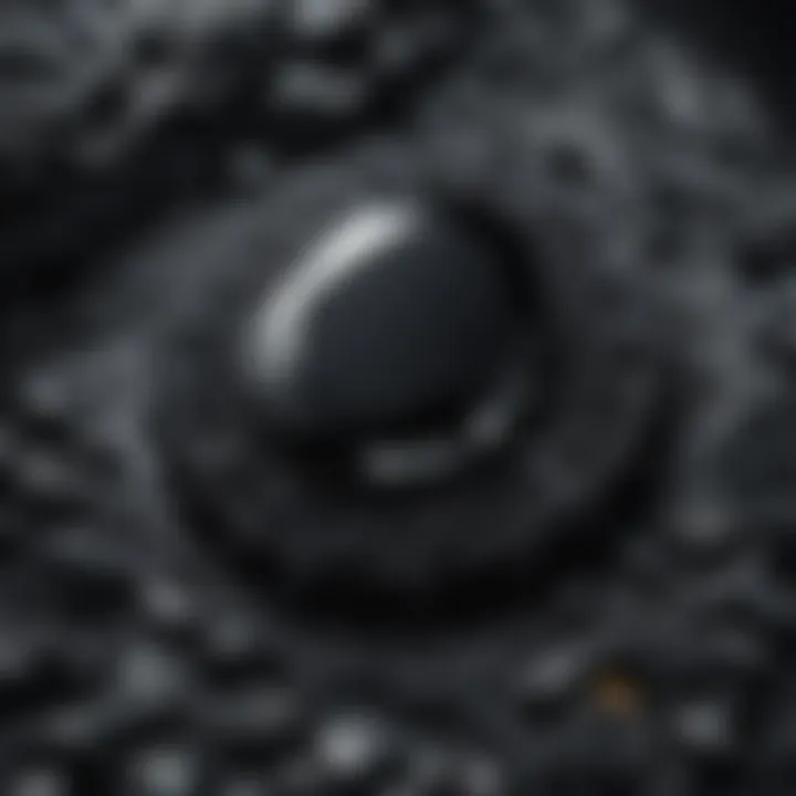 Close-up shot of a black gemstone highlighting its intricate patterns and textures.